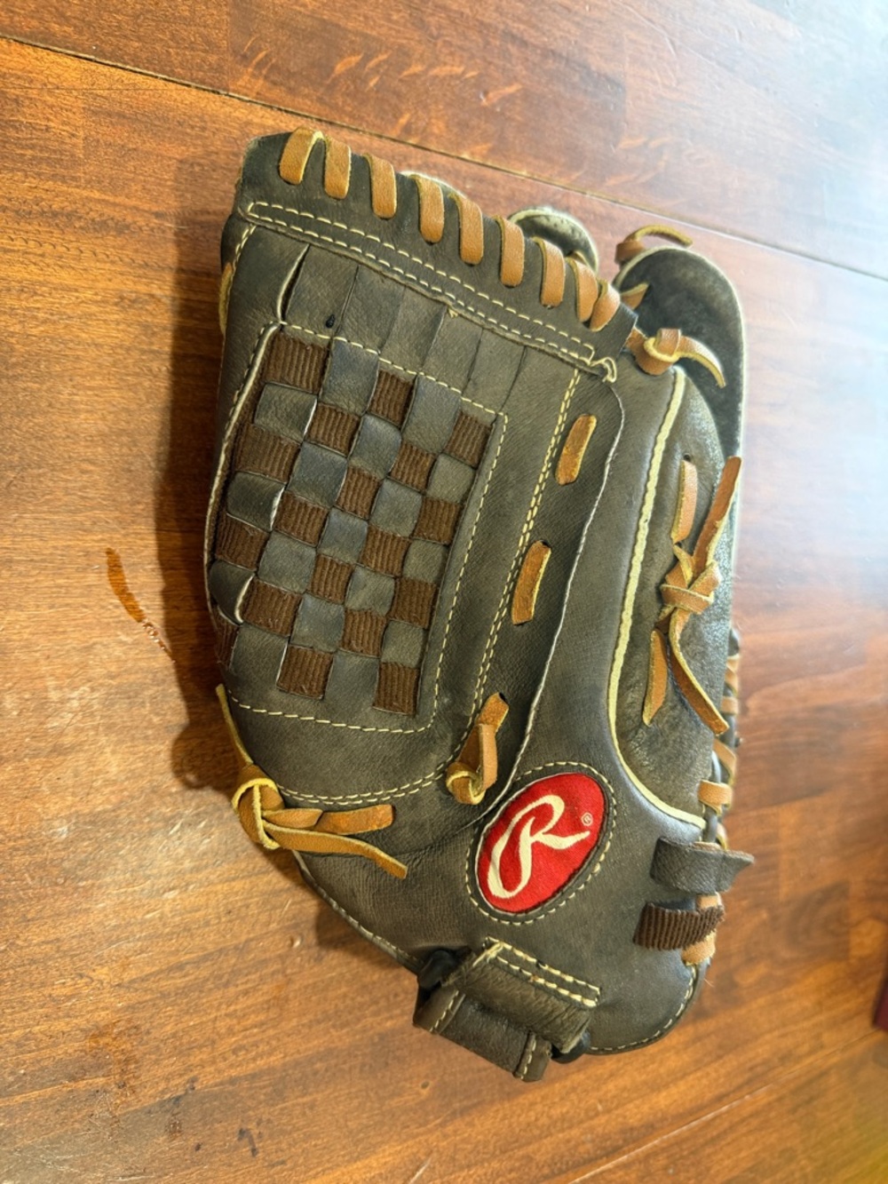 Rawlings dark brown leather baseball glove with tan laces